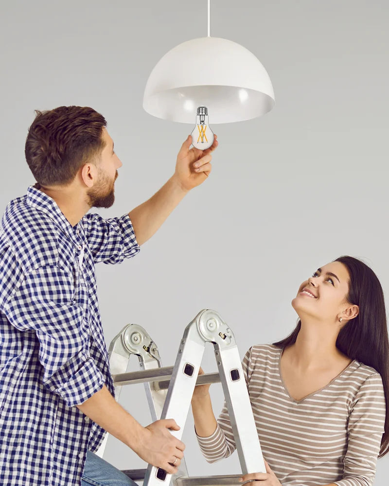 A-couple-is-changing-the-light-bulb-indoors