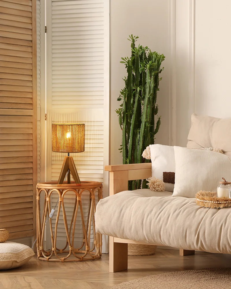Eco-Scandi-Aesthetics-style-living-room-with-a-rattan-lampshade-table-lamp-emitting-soft-and-warm-light