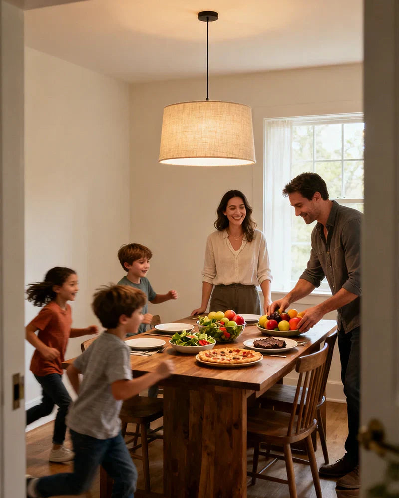 family-members-eating-at-dining-table-under-chandelier
