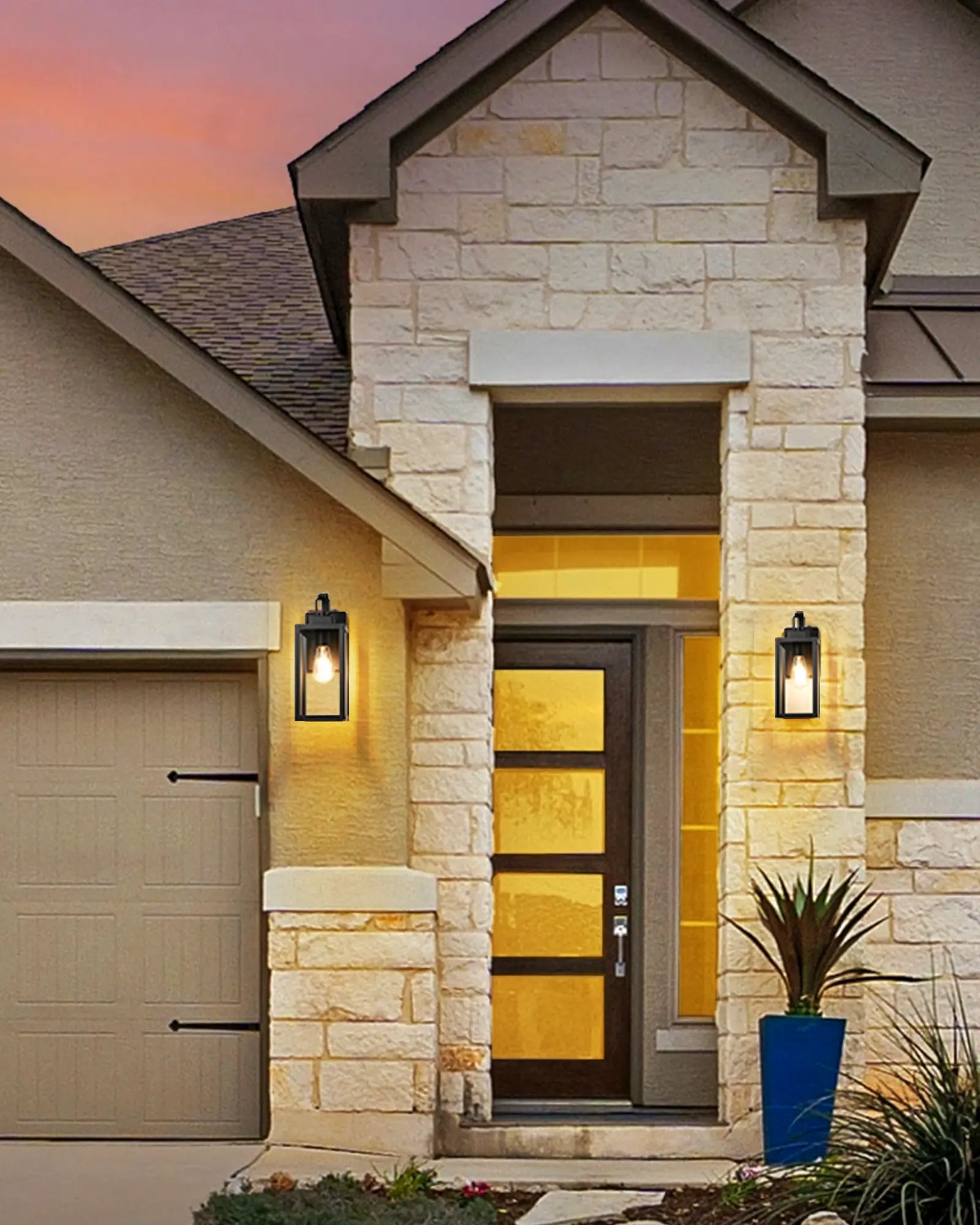 Modern house entrance with stone facade, glass door, and outdoor lighting.