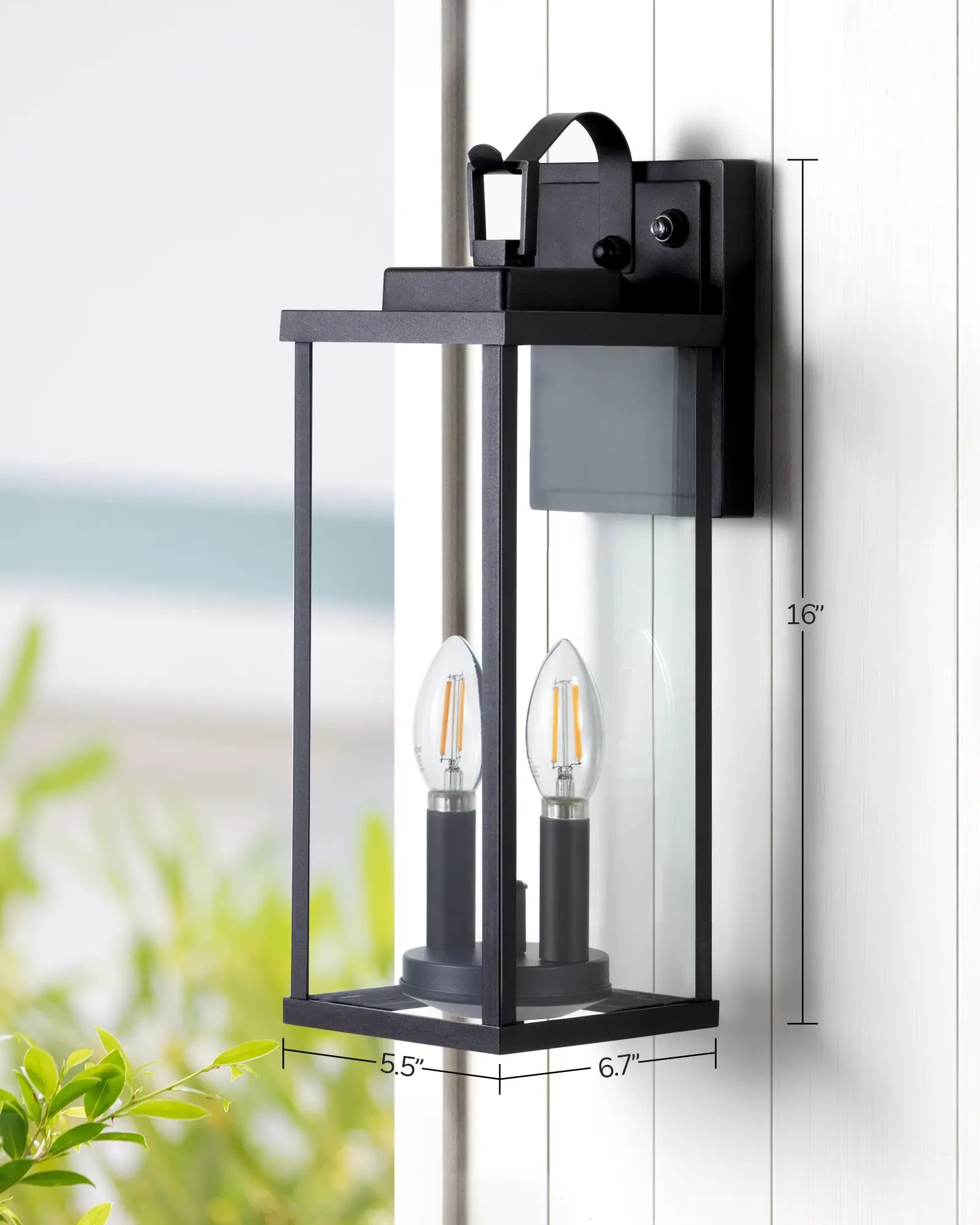 EDISHINE 16'' Dusk To Dawn Outdoor Wall Lantern-HOWL06W with measurements on a white wall.