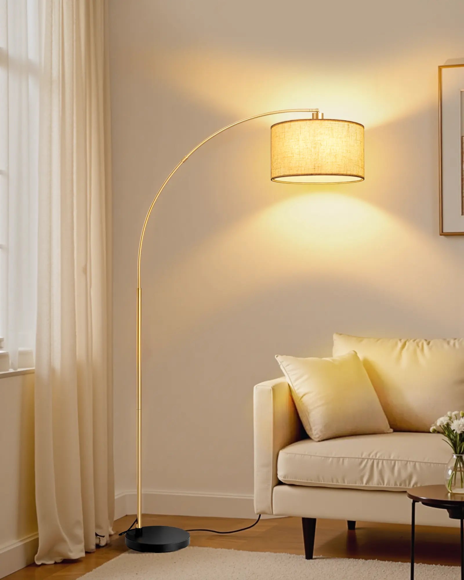 Arc floor lamp in a living room with a beige sofa and curtains.