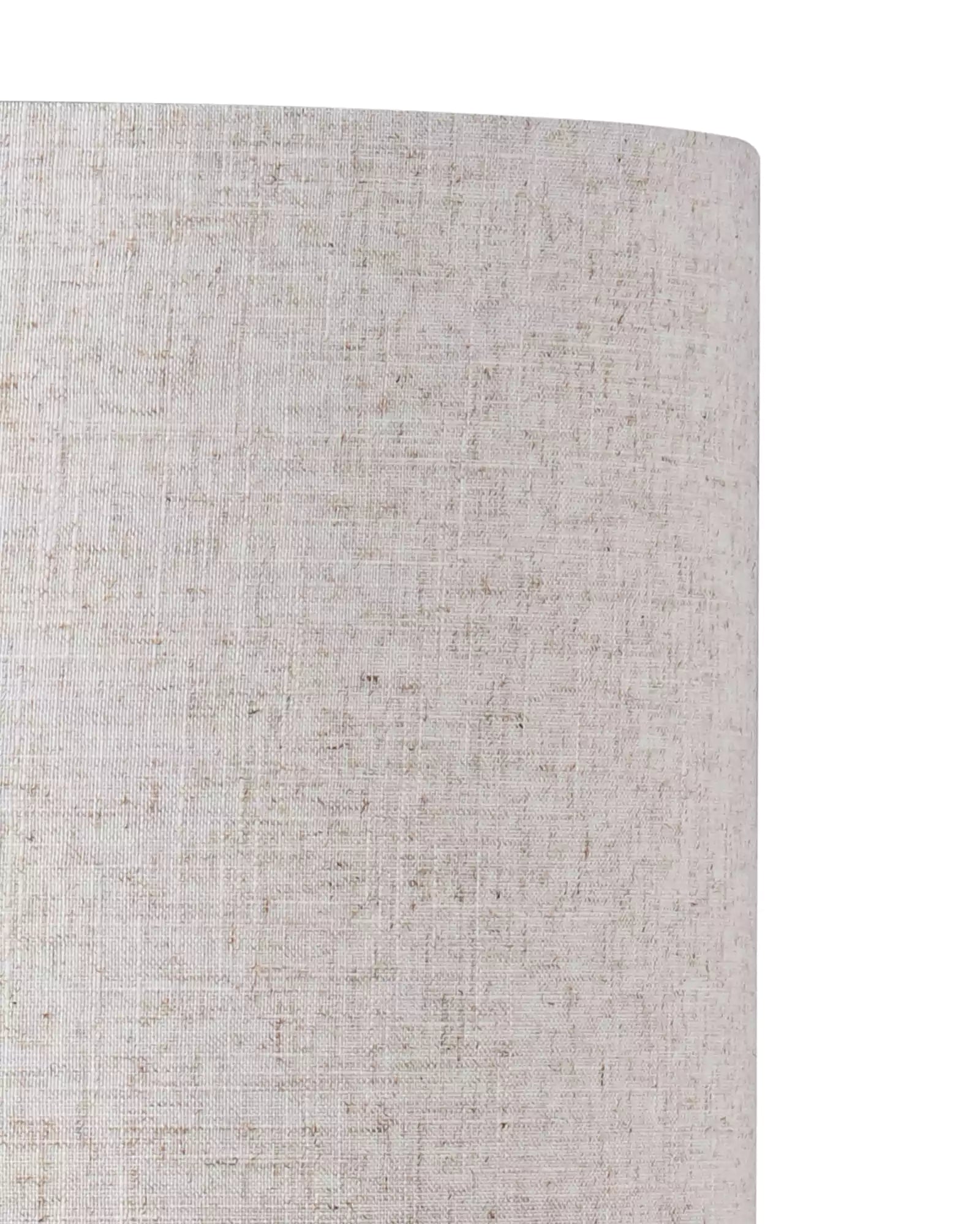 Close-up of a textured beige lampshade on a white background