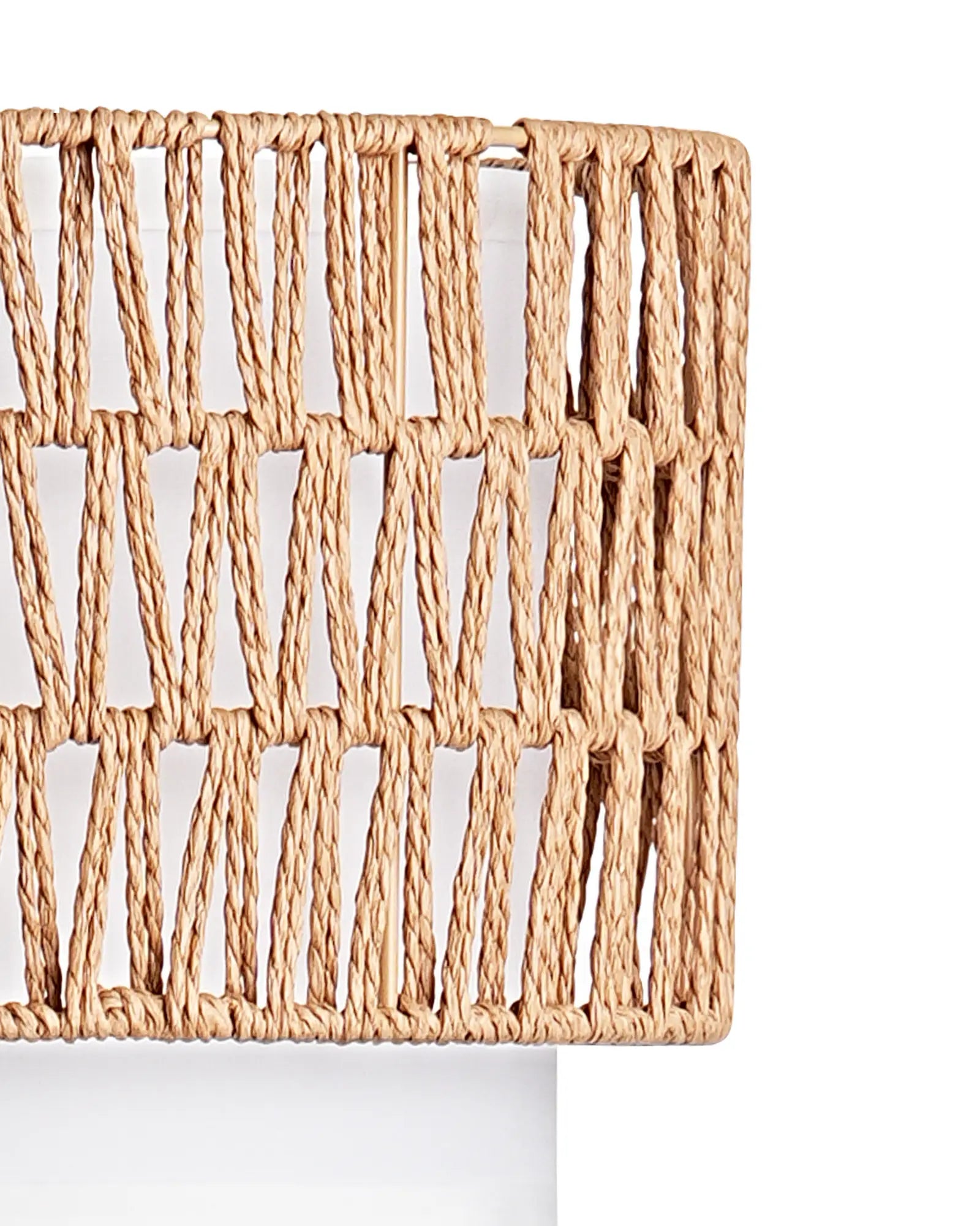 Woven natural fiber lampshade on a white background