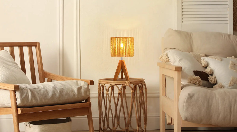 Nursery room with wooden chair, side table, and bed with teddy bear.