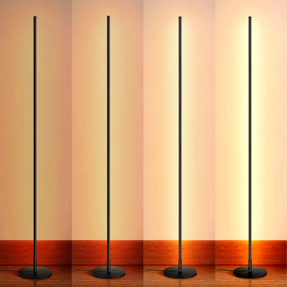 Four modern Minimalist LED Floor Lamp with a warm glow against a gradient wall.
