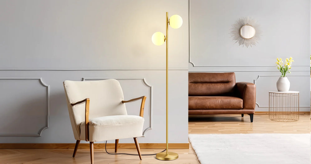 Modern living room with a white armchair, gold floor lamp, and brown sofa.