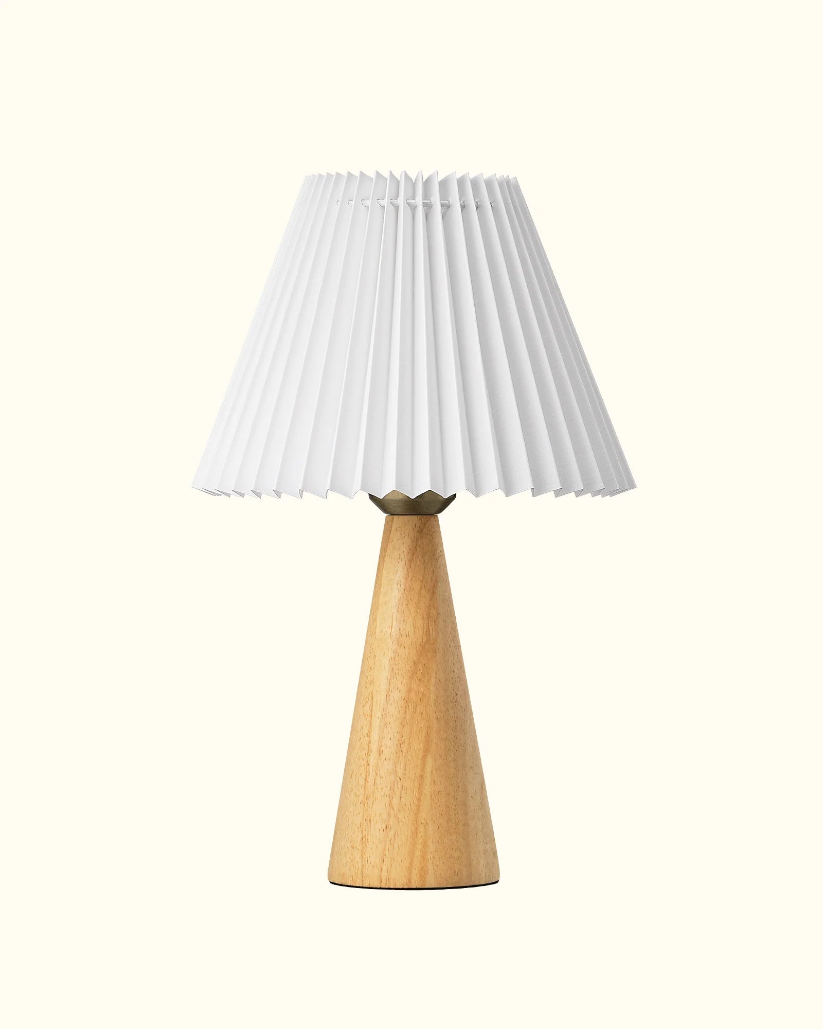 Sustainable Natural  Pleated White Table Lamp with a pleated white shade and wooden base on a white background