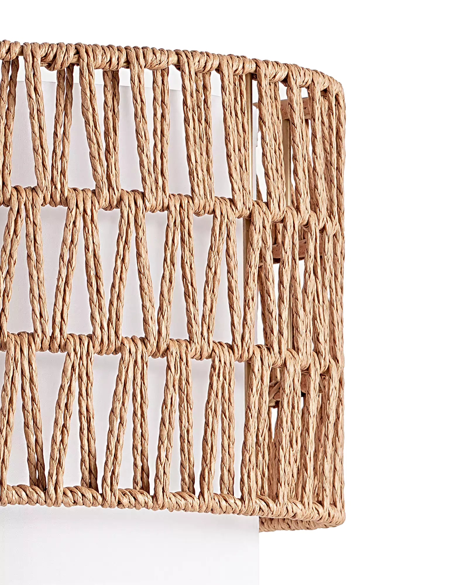 Woven mat with geometric pattern with Rattan Arc Floor Lamp on a white background