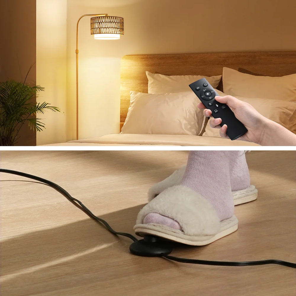 Person using a remote control to operate a heated foot massager on a bed.