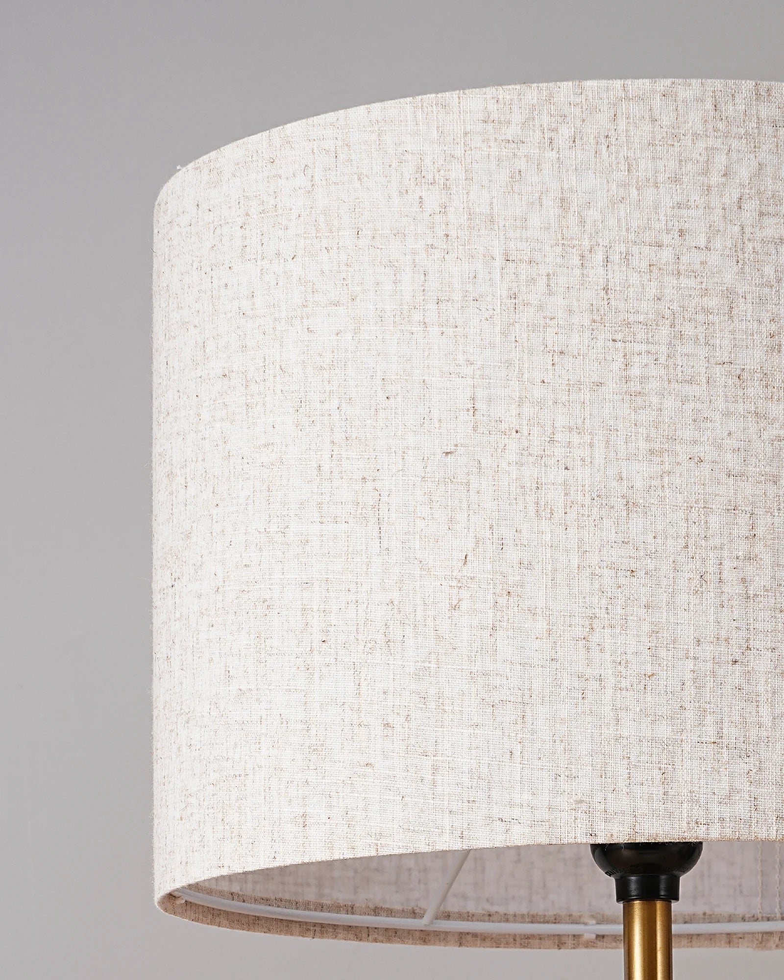 Close-up of a textured lampshade with a gray background