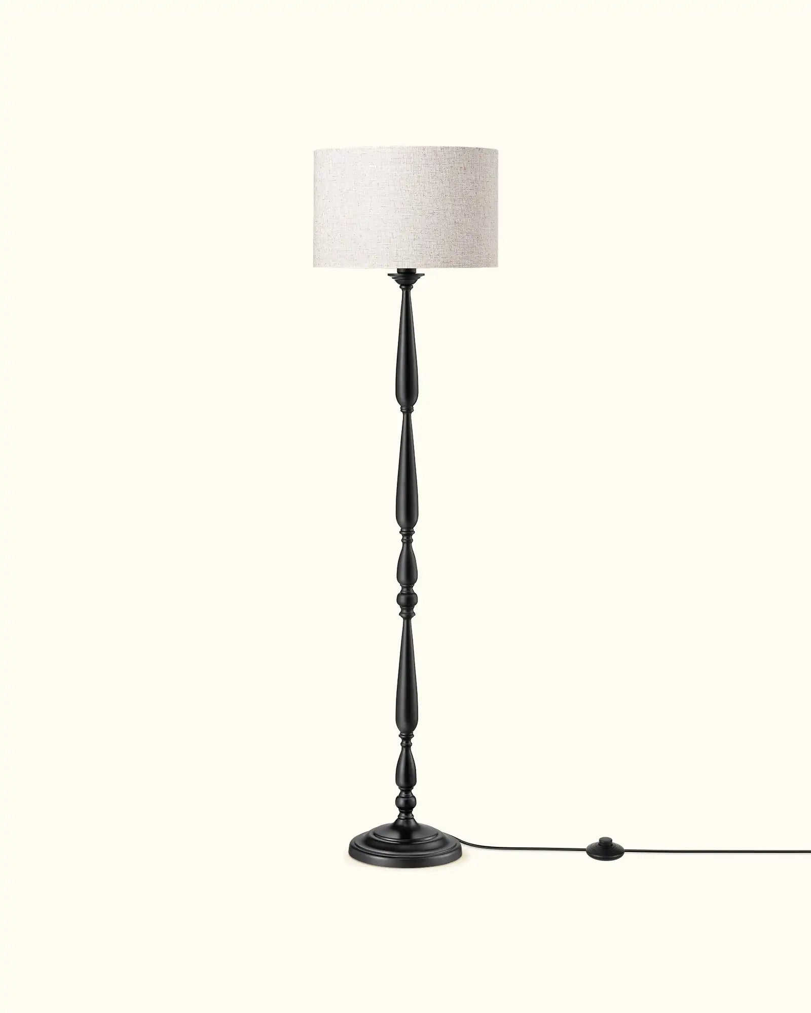 Floor lamp with a white lampshade on a white background