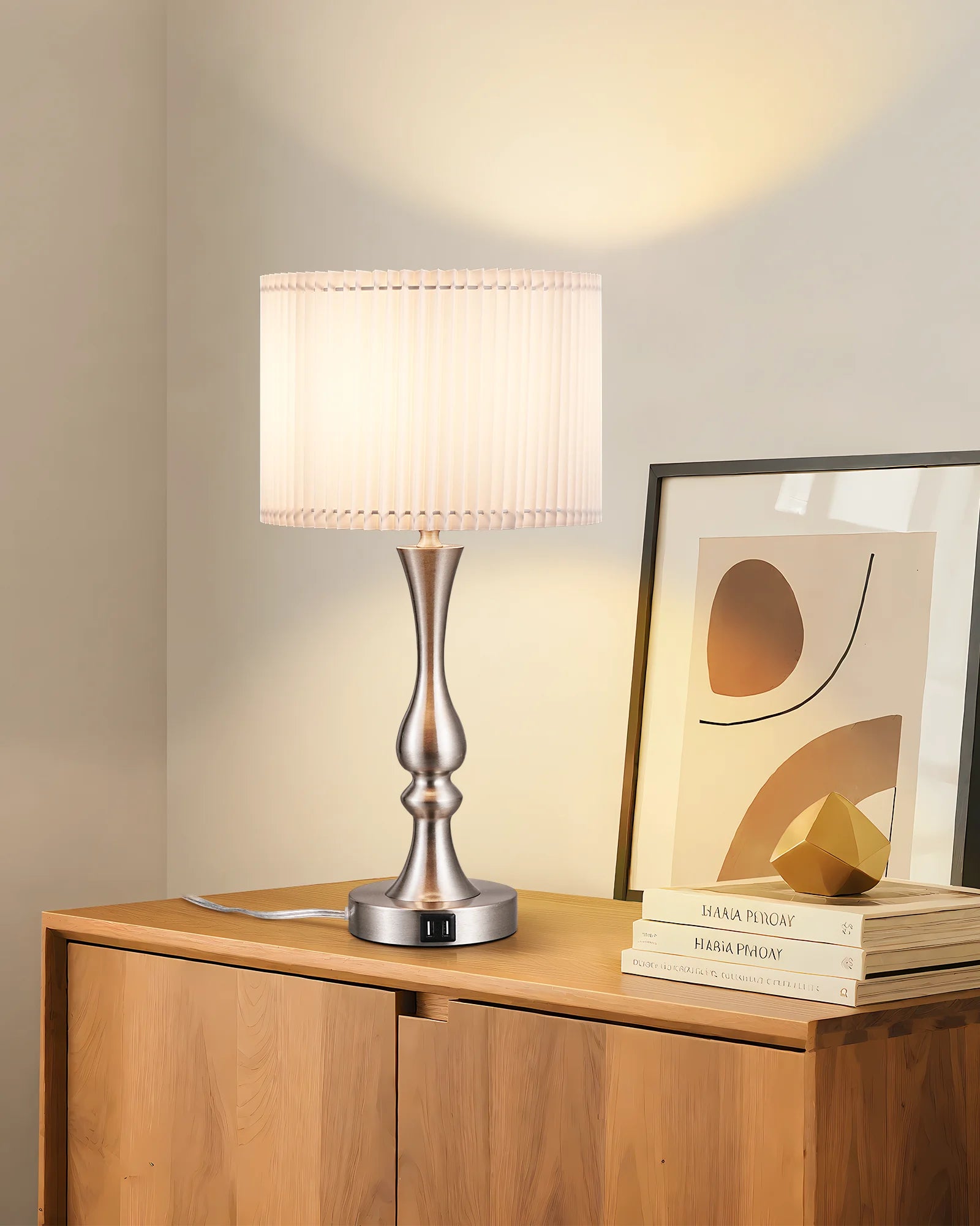 Table lamp on a wooden side table with abstract art in the background
