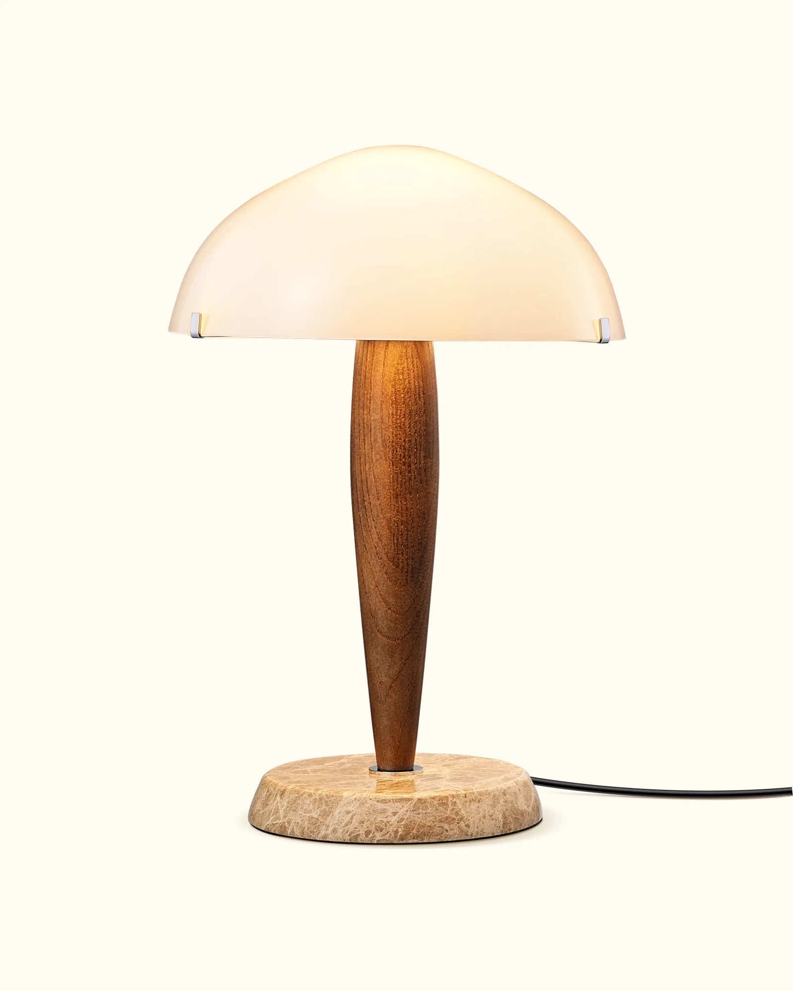 Table lamp with wooden base and white shade on a white background