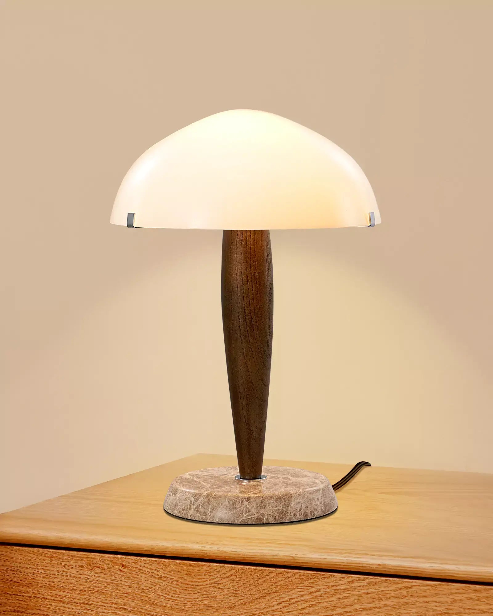 Wood and Marble Table Lamp with wooden base and white shade on a wooden surface
