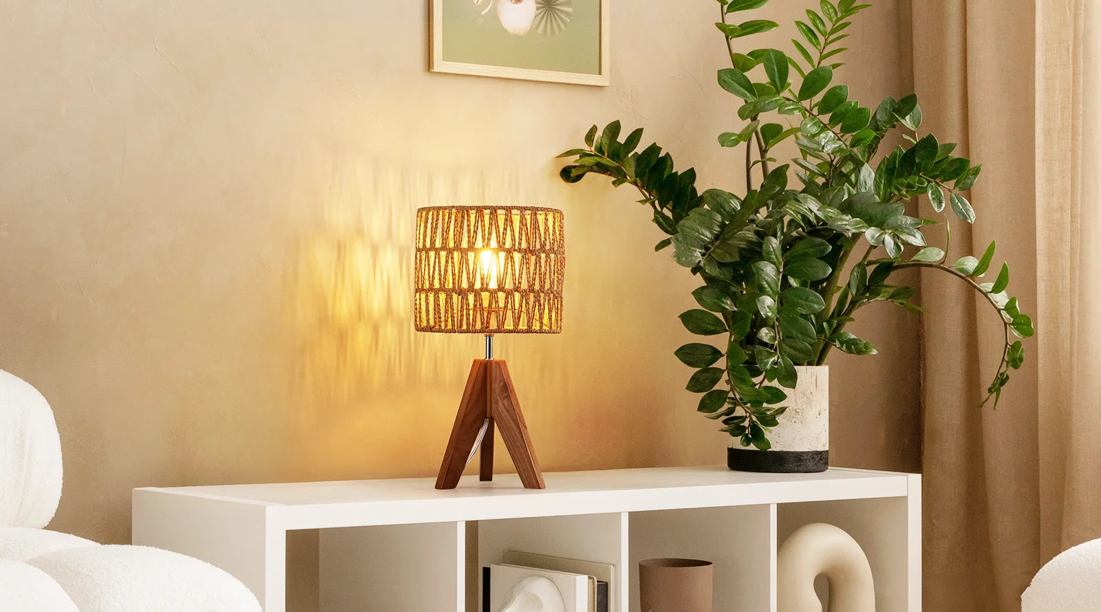 Table with a Woven Shade Table Lamp and plant in a home setting