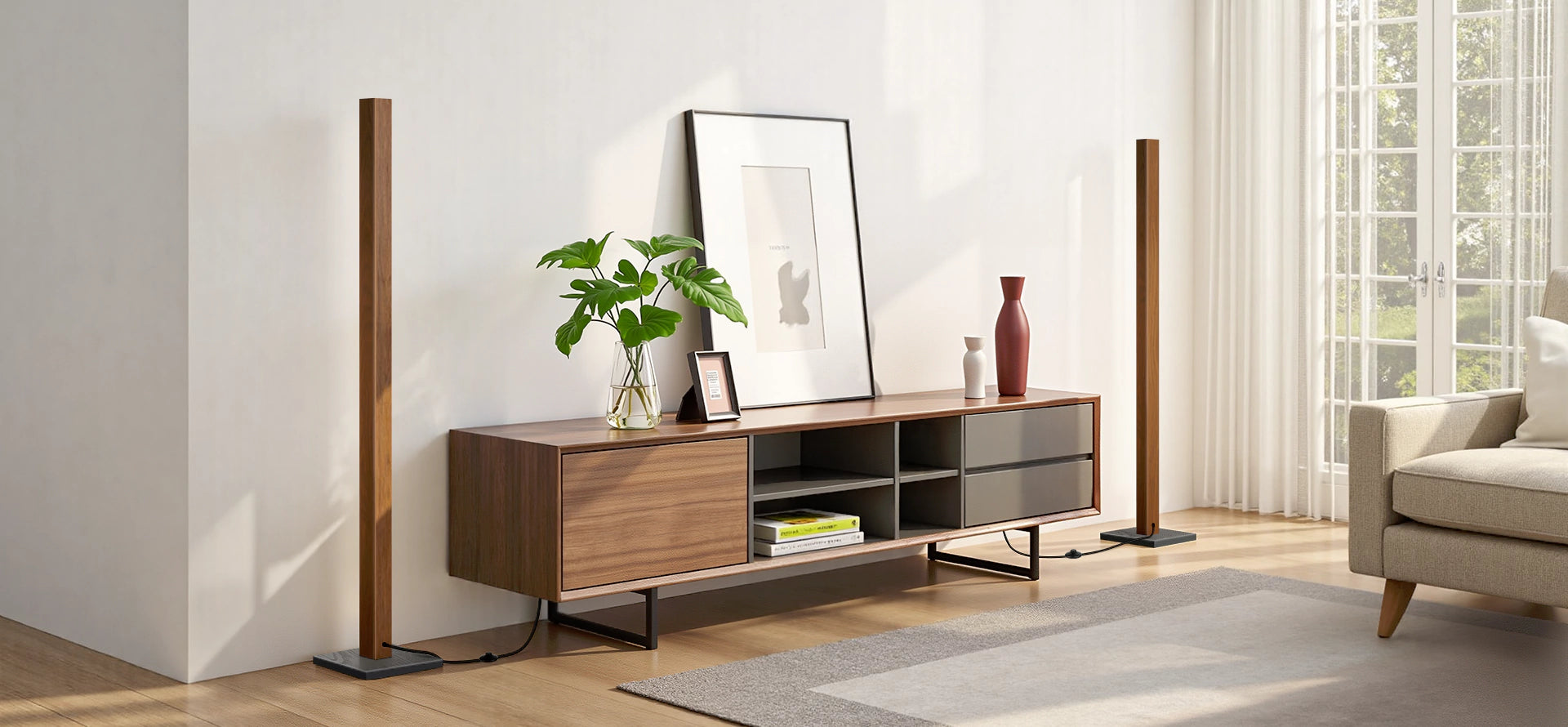Modern living room with wooden TV stand, decorative items, and a sofa.
